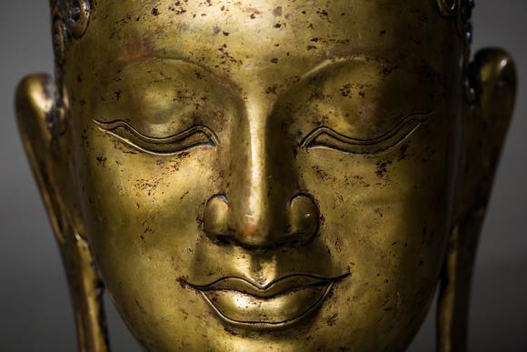 a gilt bronze buddha head
