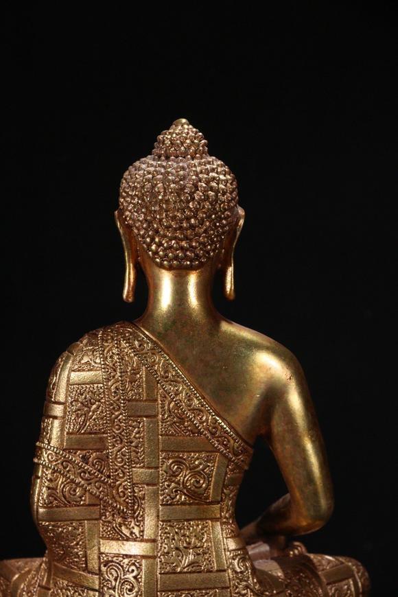 a gilt bronze gautama buddha