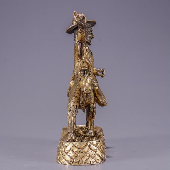 铜鎏金骑羊护法造像