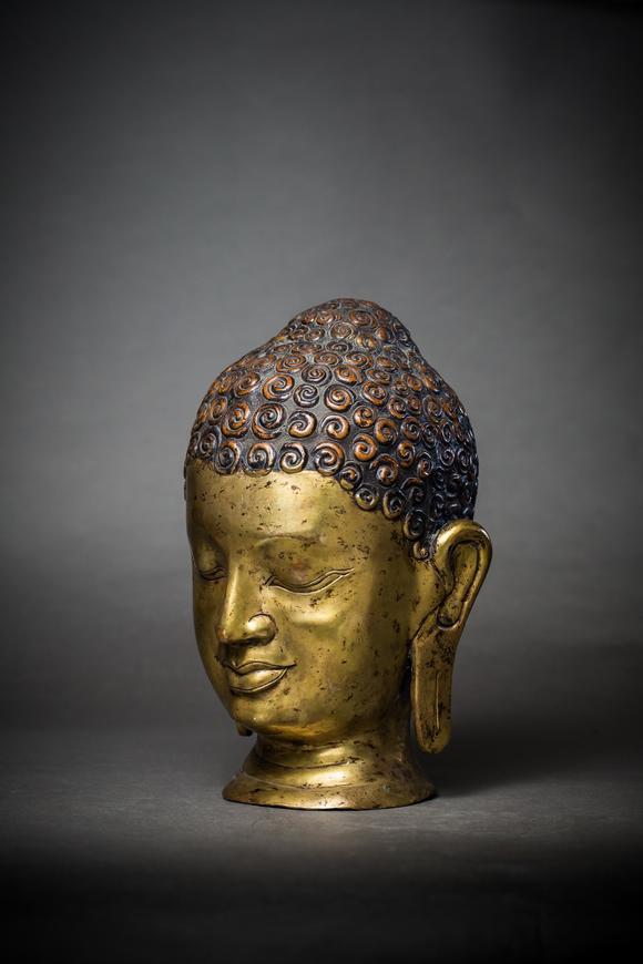 a gilt bronze buddha head