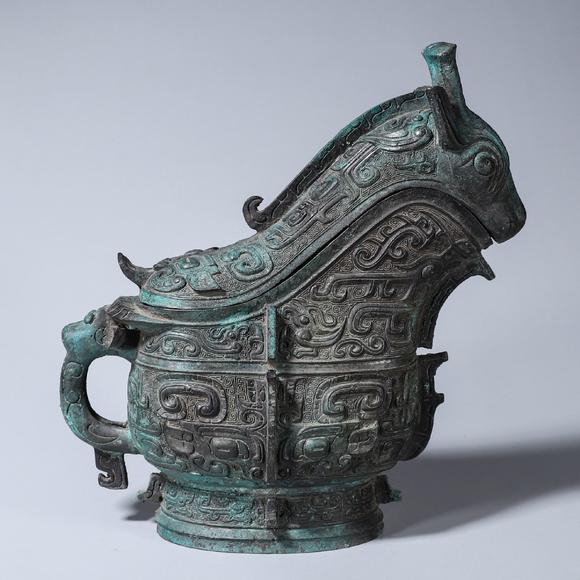 a taotie patterned bronze goat head pot 羊頭饕餮紋青銅觥