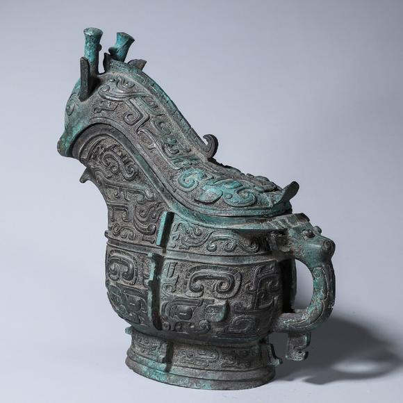 a taotie patterned bronze goat head pot 羊头饕餮纹青铜觥