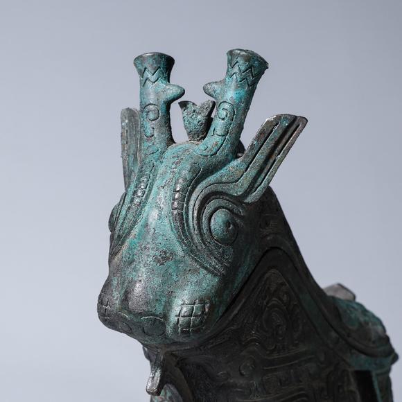 a taotie patterned bronze goat head pot 羊头饕餮纹青铜觥