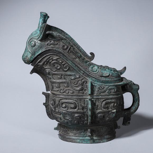 a taotie patterned bronze goat head pot 羊头饕餮纹青铜觥