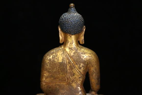 a gilt bronze gautama buddha
