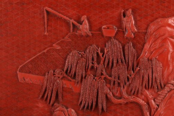 a chinese landscape carved red lacquerware table